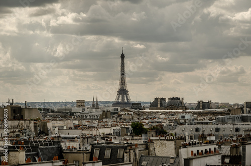 Cloudy view over the rooftops of the France city Paris.