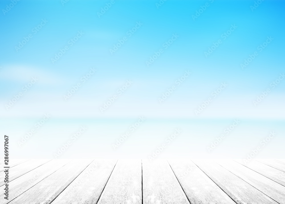 The blur cool sea background with wood floor foreground on horizon tropical sandy beach.	