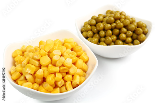 Canned Corn and Canned Green Peas. Isolated with clipping path.