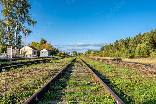 Railroad tracks extending into the distance. Railway station in a small town. Uglich, Russia.