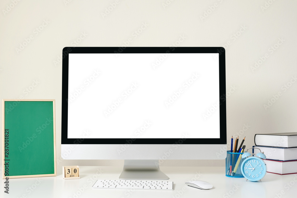 Design of workplace with computer white screen is standing on a desk in an office, Business Concept, copy space Design of workplace with computer white screen is standing on a desk in an office, Business Concept, copy space