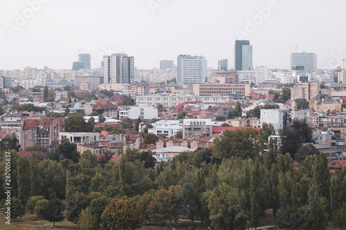 Cityscape of old part of Bucharest, with many worn out buildings, as seen from the Palace of Parliament