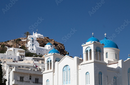 Greece, the island of Ios. The capitol of the island, the Hora, or ‘Village’. A view of the main church, and a series of small chapels on the hillside.