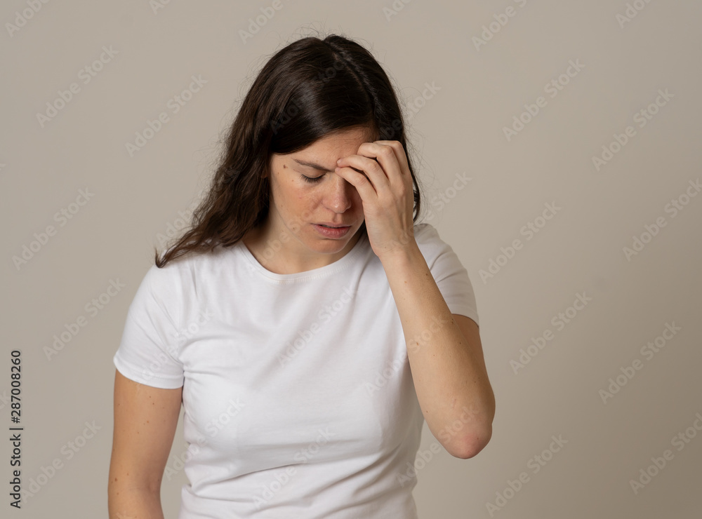 Portrait of sad and depressed woman. Isolated on neutral background. Human expressions and emotions Portrait of sad and depressed woman. Isolated on neutral background. Human expressions and emotions