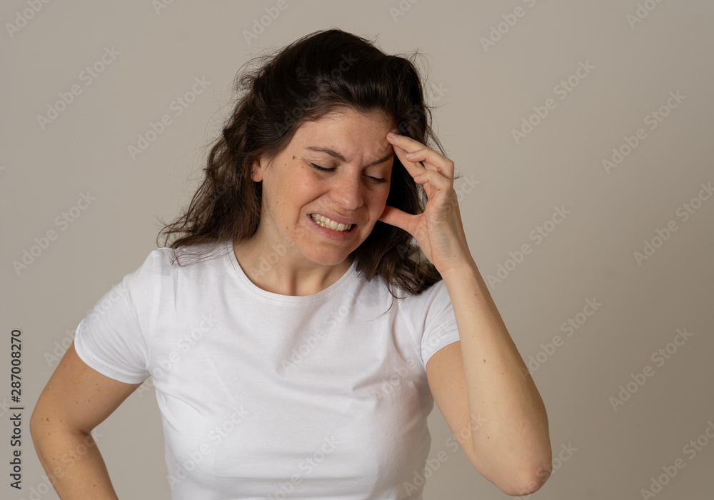 Portrait of sad and depressed woman in pain having headache. Health problems concept Portrait of sad and depressed woman in pain having headache. Health problems concept