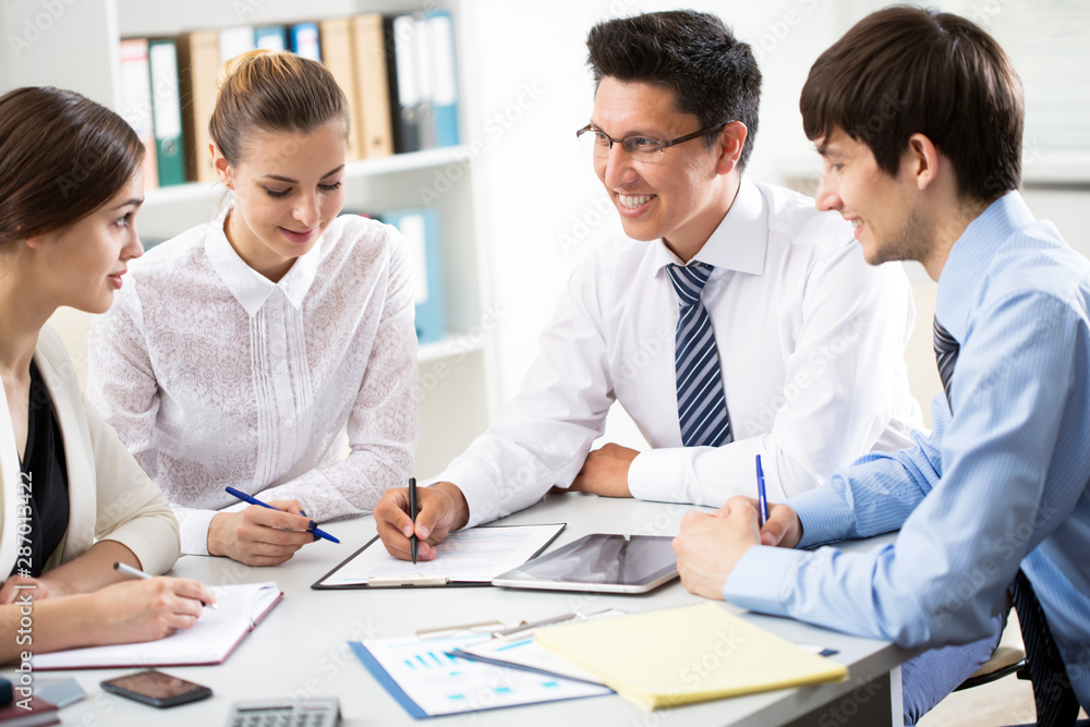 Businessman tells his colleagues about a new project Businessman tells his colleagues about a new project