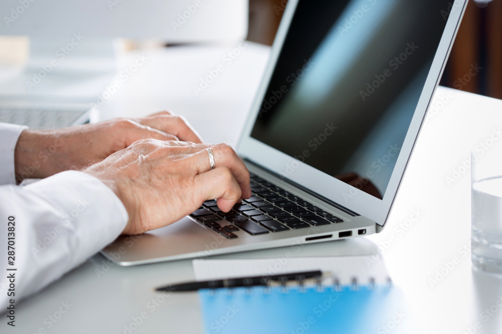 Closeup of businessman's hands working with laptop Closeup of businessman's hands working with laptop