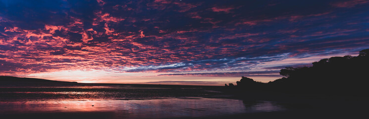 Leinwandbilder Purpur A beautiful transition between daylight and moonlight over an Australian beach.  © Aaron