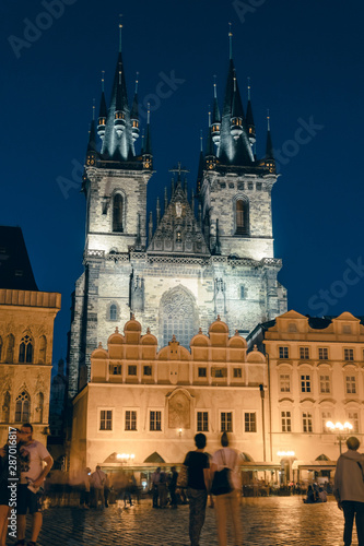 the main square, on the street of the old city of Prague, night time. historical center. travel and tour in Europe, tourism. Praha, vertical photo