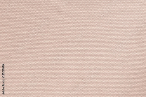 Cotton fabrics textile textured background in light pale beige color