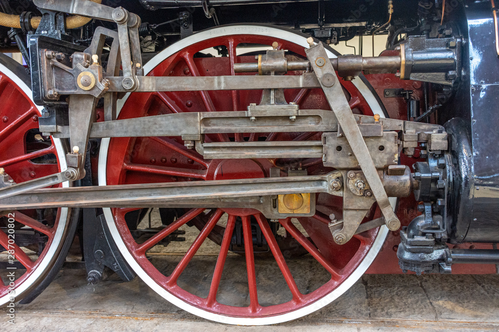 Restored wheels of an ancient steam train Restored wheels of an ancient steam train