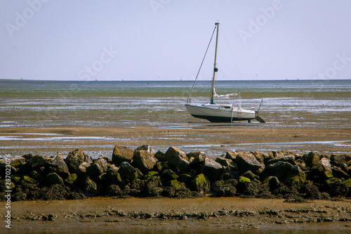 Fototapeta The Wadden Sea, with its fascinating interplay of high and low tide or in other