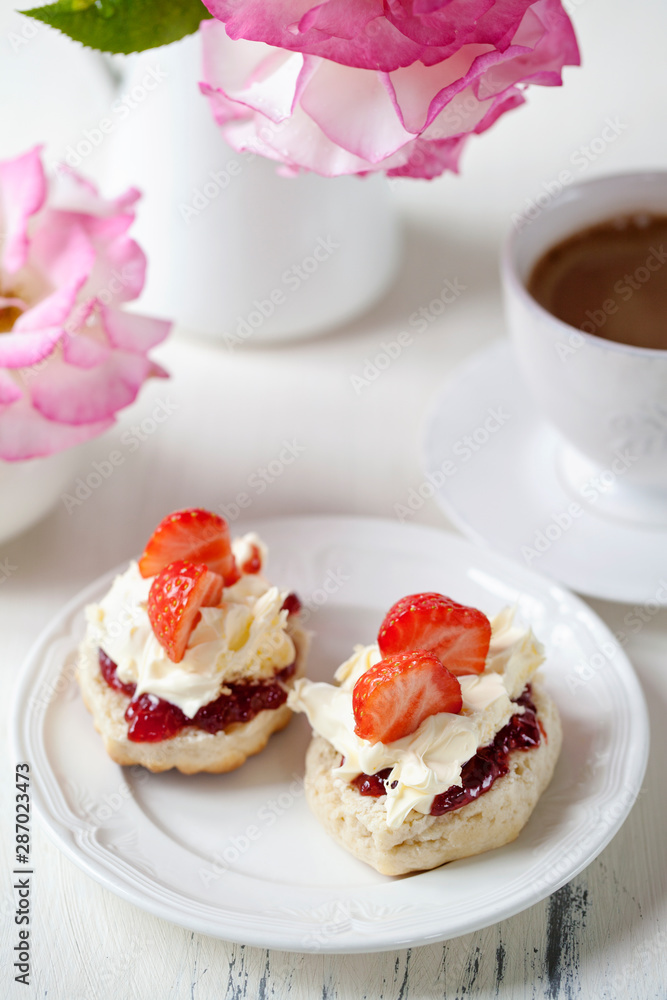 Scones with cream and strawberries Scones with cream and strawberries