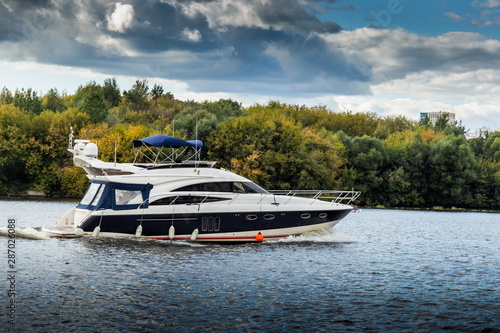 Luxury yacht on a river. © Sergey Fedoskin