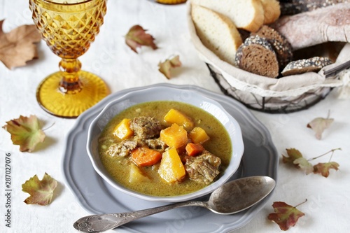 thick soup with pumpkin and beef. hearty autumn dish