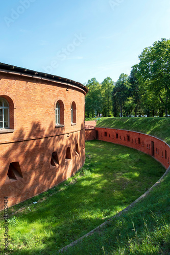 Fort Legionow made with red brick, a component of the Warsaw fortress in summer day, Poland photo