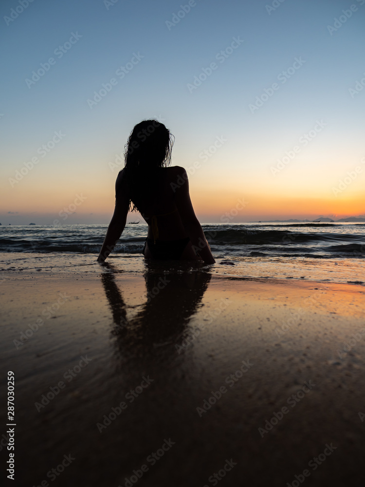 Fototapeta premium woman sunbathing on the tropical beach
