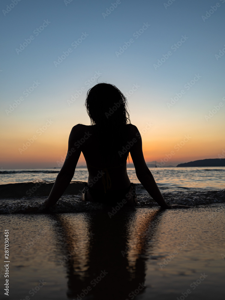 woman sunbathing on the tropical beach
