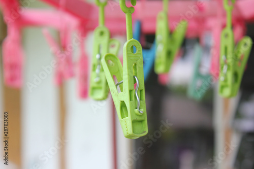 Colorful plastic clothespins on the hangers, clothespins on the hangers rope for wash clothes.