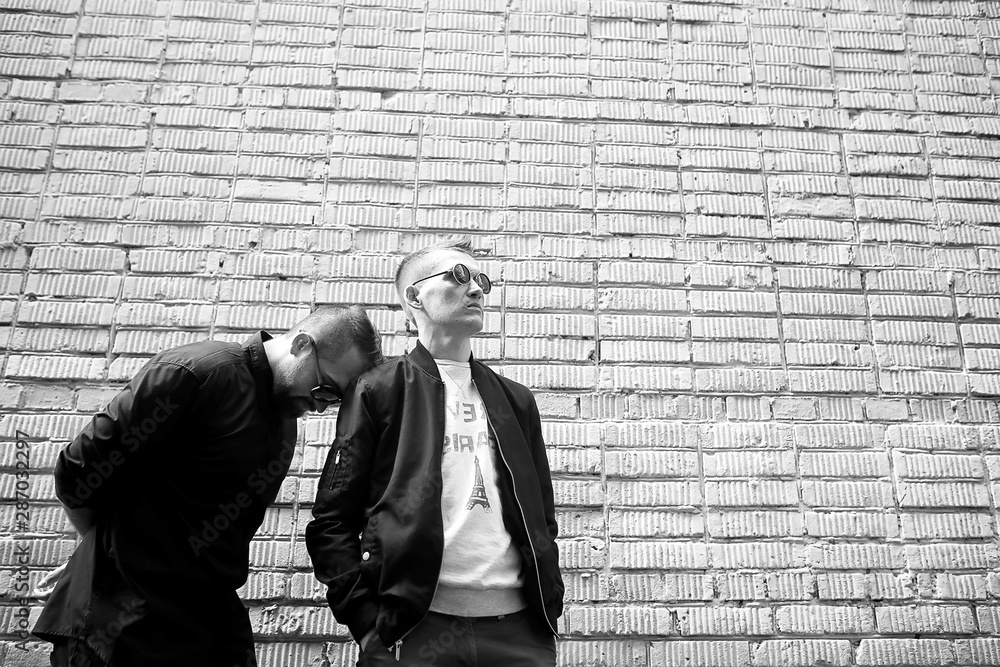 Two men in the street black and white Two men in the street black and white