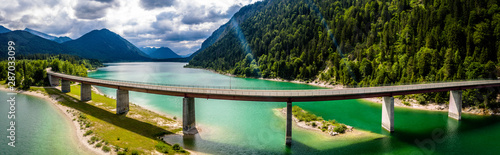 Sylvenstein Lake Bavaria Germany. Bridge for cars over water. Aerial View photo