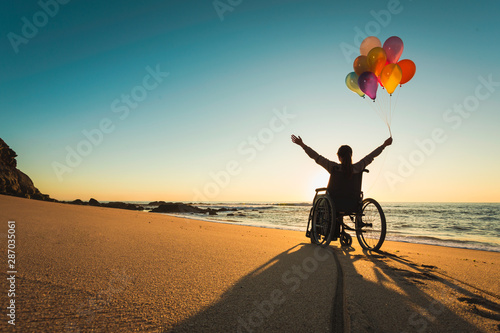 Woman on a wheelchair photo