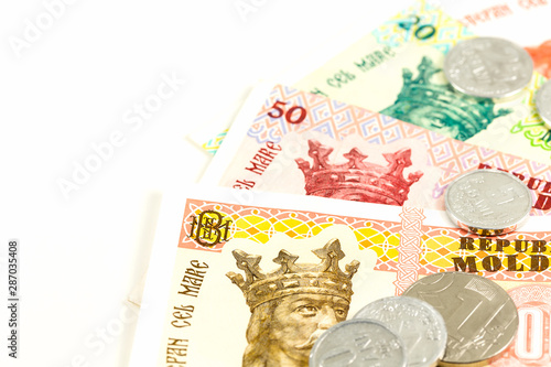 detail of some moldovan leu banknotes and coins indicating growing economics with copyspace on the left photo