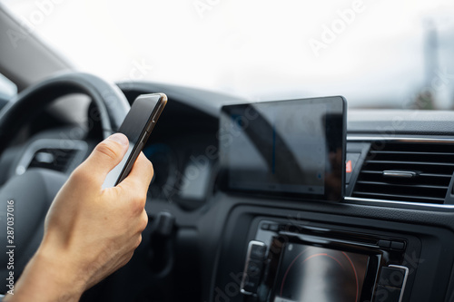 Modern driver set navigation system by smartphone. © Lalandrew