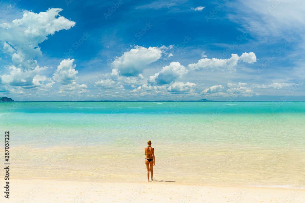 woman sunbathing  on the tropical beach