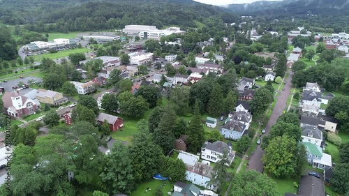 4K aerial establishing shot of the small American town of Waterbury, Vermont, in the Green Mountains, USA photo