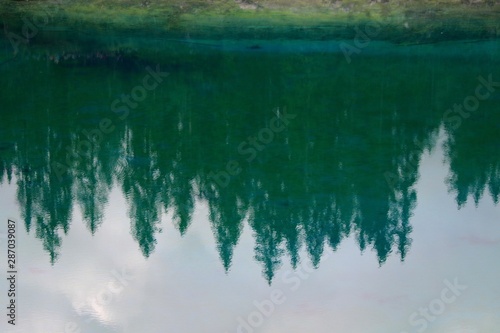 Dolomites  Italy. Mountains and Trees  Reflection in the Lake