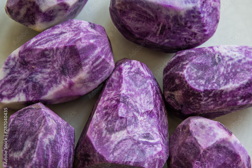 Fototapeta premium close up on Vitelotte blue-violet potato