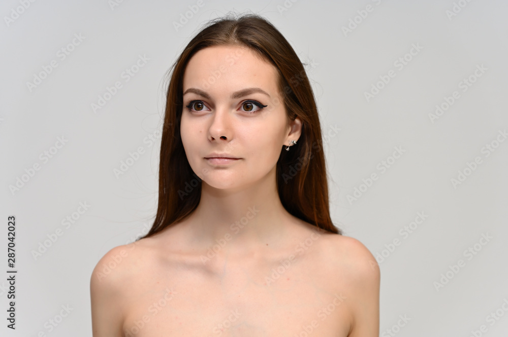 Close-up Portrait of a cute brunette girl, a young woman with beautiful curly hair and beautiful face skin. Beauty, brightness, smile, health. Close-up Portrait of a cute brunette girl, a young woman with beautiful curly hair and beautiful face skin. Beauty, brightness, smile, health.