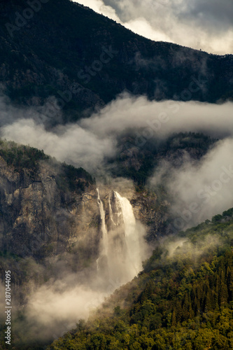 Feigumfossen waterfall off the shore of Lustrafjord in Norway