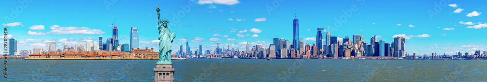 Panorama of The Statue of Liberty with the One world Trade building center over hudson river and New York cityscape background, Landmarks of lower manhattan New York city.