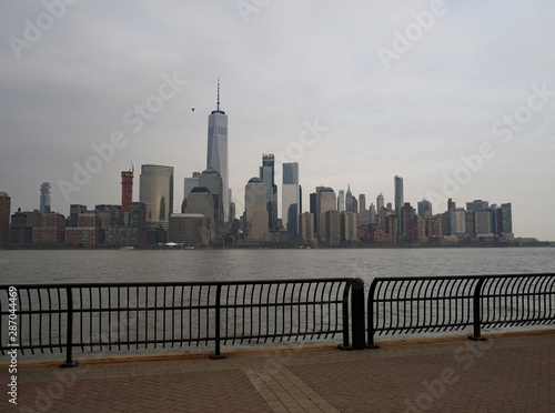 New York Skyline seen from New Jersey, view from the hudson river behind safety rail