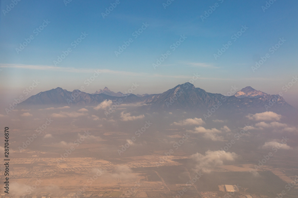 Fototapeta premium Mountains and vistas seen from the air from Mexico City to Monterrey.