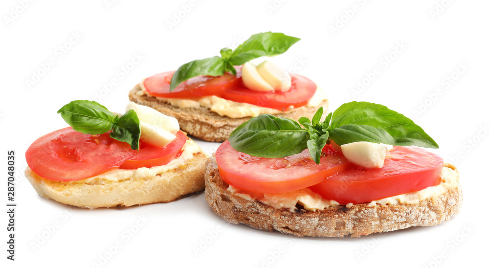 Tasty fresh tomato bruschettas on white background Tasty fresh tomato bruschettas on white background