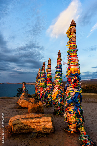 Sacred buryat place on Olkhon island with beautiful sky and clouds, lake Baikal, Russia