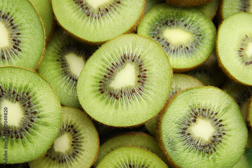 Halves of fresh kiwis as background, above view Halves of fresh kiwis as background, above view