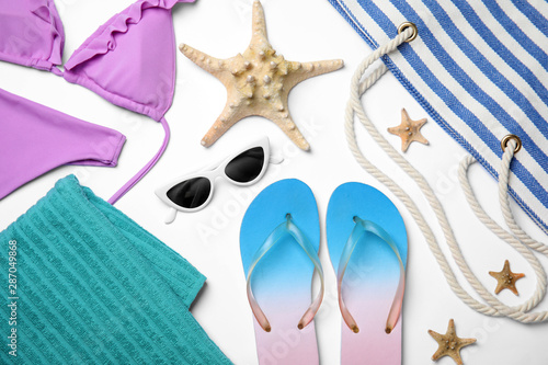 Flat lay composition with beach objects on white background