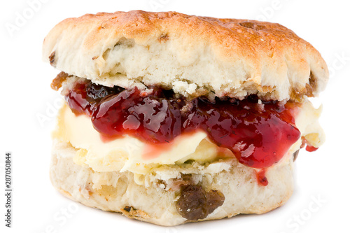 Scone with strawbwey jam and clotted cream. photo