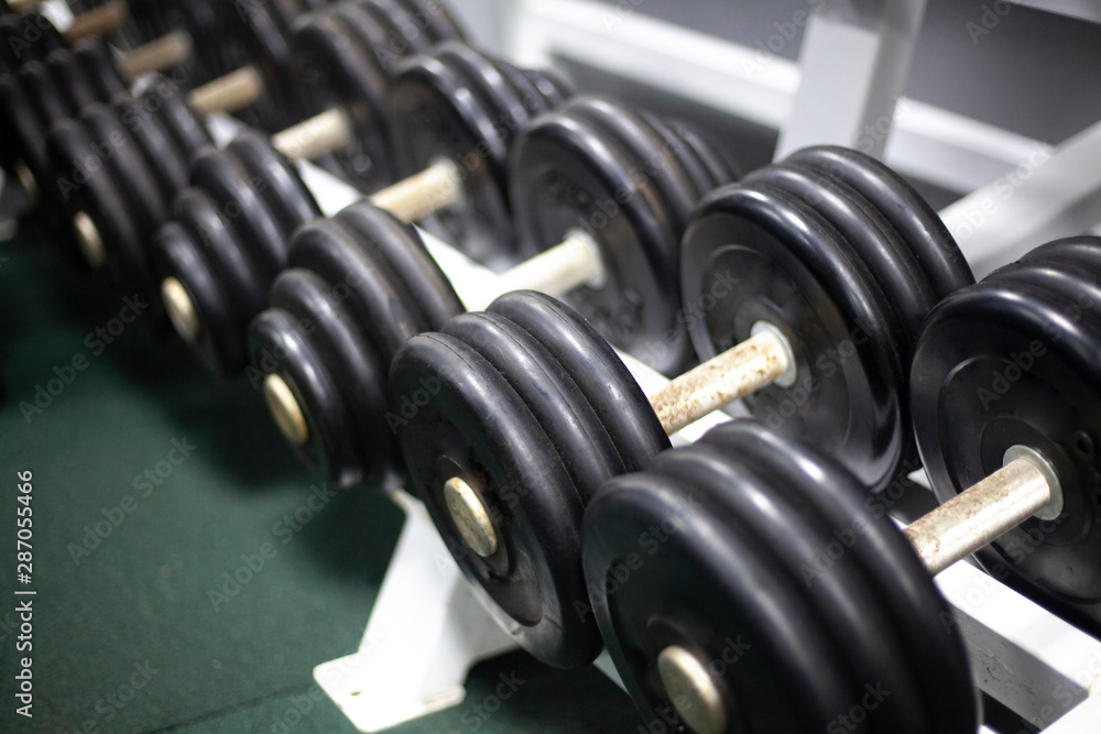 Dumbbells for sports. Dumbbells are in a row. Sport equipment. Occupation for men. Metal products. Dumbbells for sports. Dumbbells are in a row. Sport equipment. Occupation for men. Metal products.