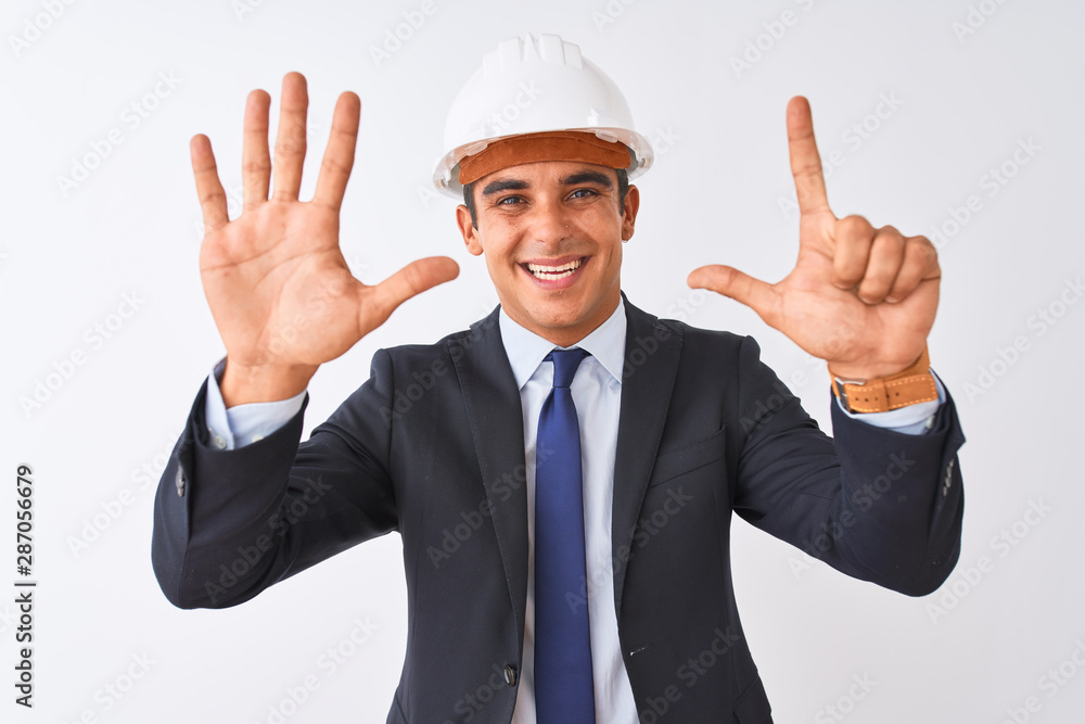 Young handsome architect man wearing suit and helmet over isolated white background showing and pointing up with fingers number seven while smiling confident and happy. Young handsome architect man wearing suit and helmet over isolated white background showing and pointing up with fingers number seven while smiling confident and happy.