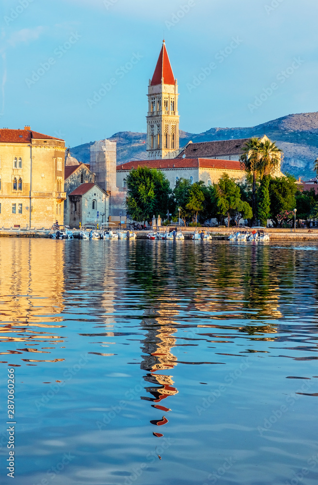 Trogir cathedral is mirroring in sea, Croatia, sunrise time