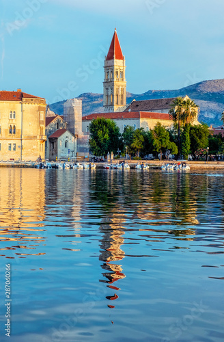 Trogir cathedral is mirroring in sea, Croatia, sunrise time photo