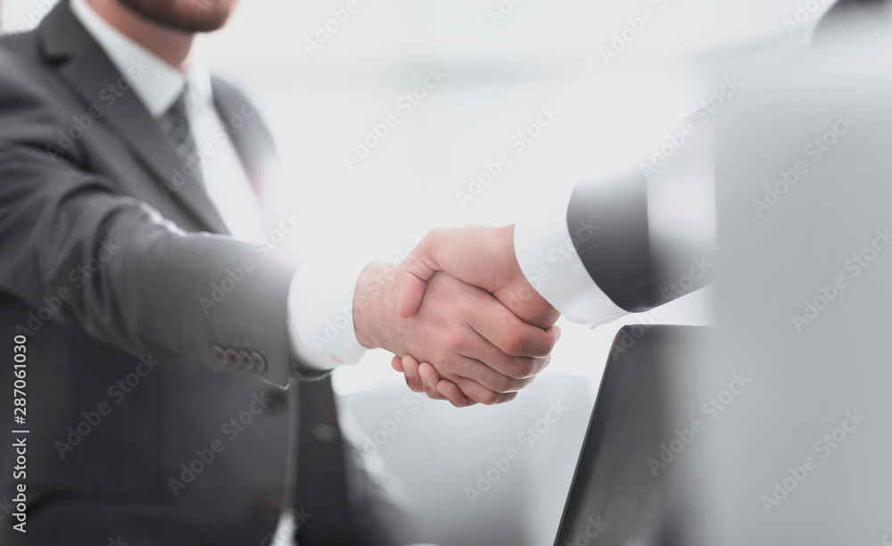Confident businessman shaking hands Confident businessman shaking hands