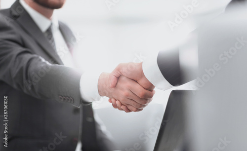Confident businessman shaking hands