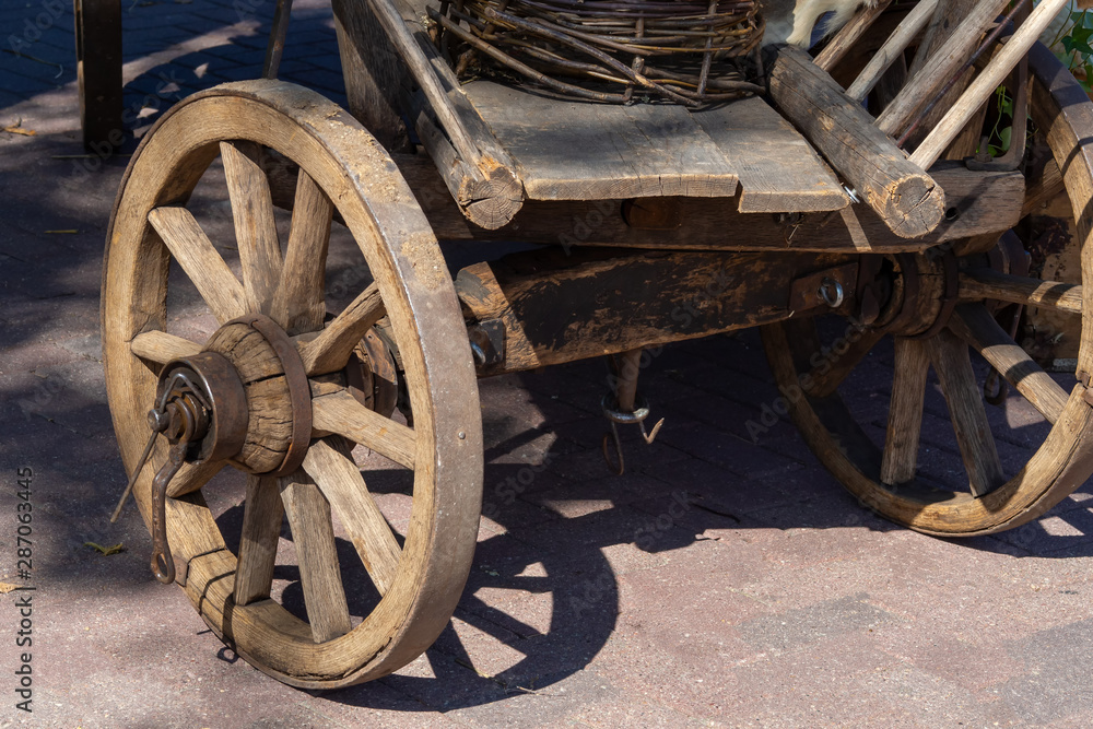 Old cart and wheel closeup. Vintage and antiquity
