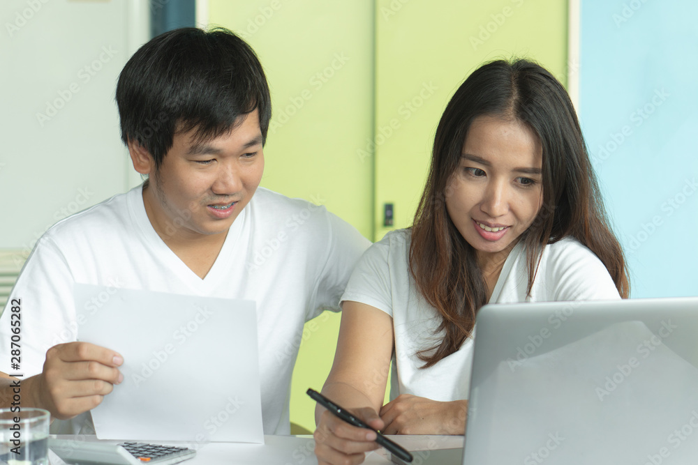 Comfort e-commerce shopping, Asian couple shopping online and payment by credit card. Comfort e-commerce shopping, Asian couple shopping online and payment by credit card.